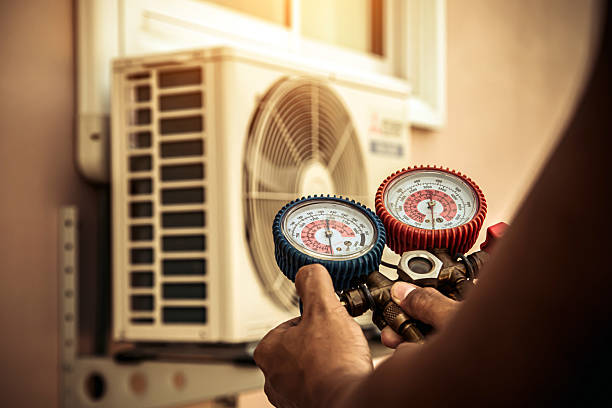 Professional Air Conditioning Service technician working in Cascade, WI
